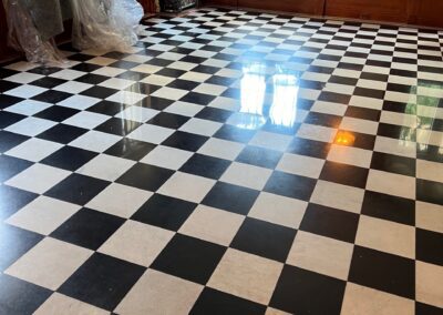 Black and white checkered terrazzo floor restoration completed by Marble Lite Inc. in a New York City commercial space.